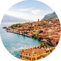 Travel insurance for Italy trips can help protect your vacation to see this view of Limone Sul Garda city and Garda lake.