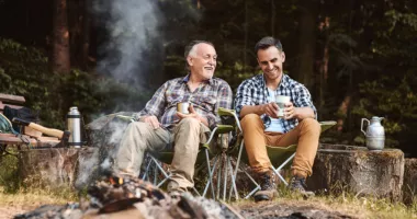 Father and son at a campfire, which could create wildfire smoke