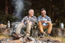 Father and son at a campfire, which could create wildfire smoke