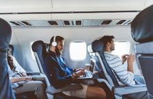 Travelers working and relaxing on a flight