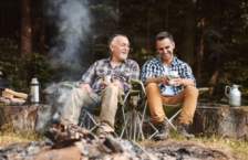 Father and son at a campfire, which could create wildfire smoke