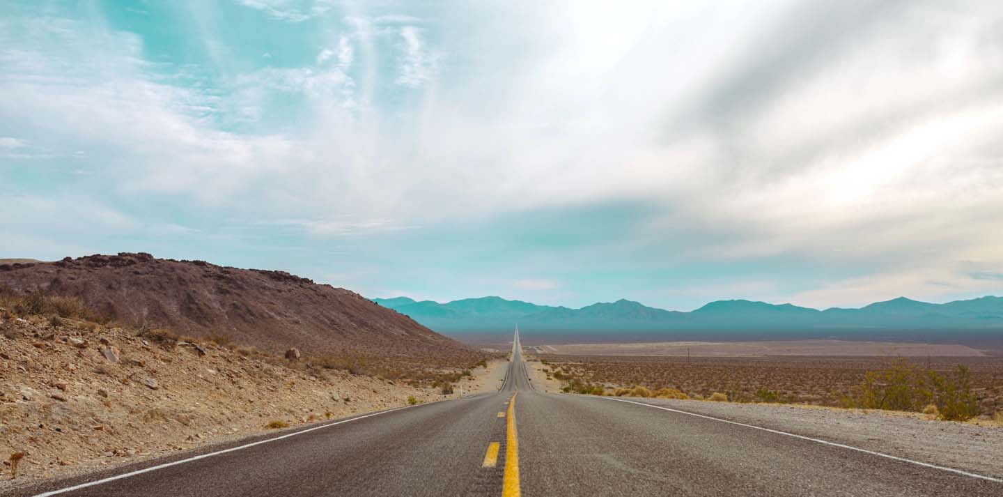 photo of a long straight road