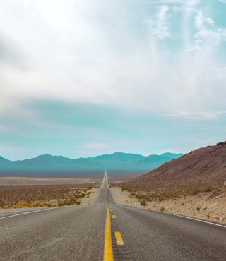 photo of a long straight road small