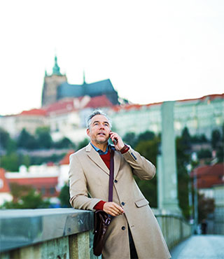 Man talking on phone on business trip