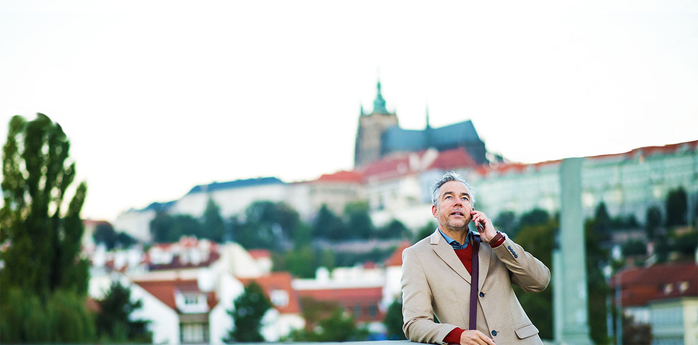 Man talking on phone on business trip