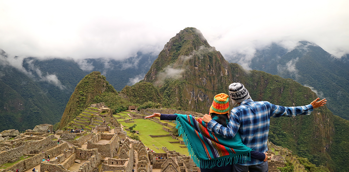 couple looking over machu picchu