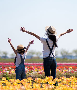 Family in garden of flowers