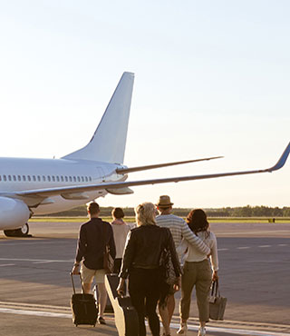 passengers walking towards airplane