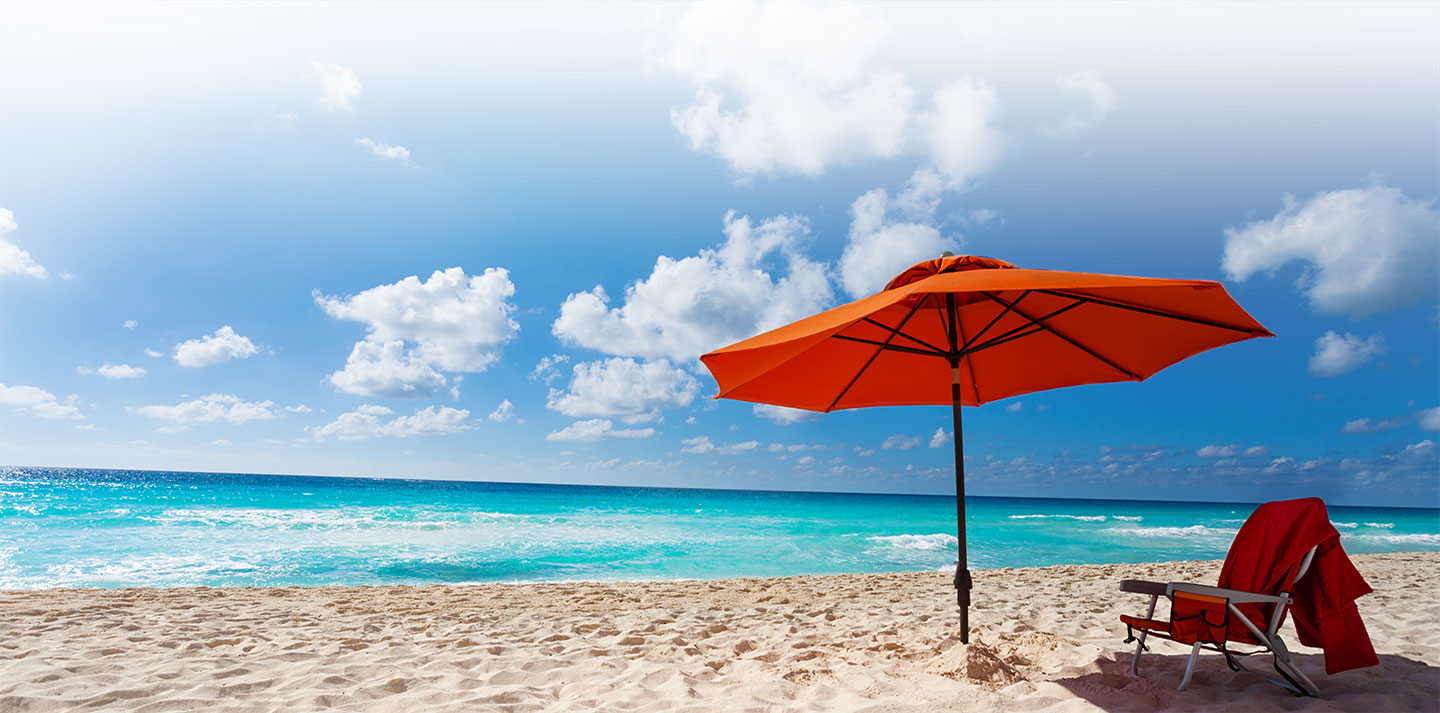 beach chair and umbrella on beach