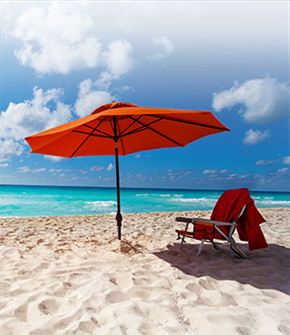 beach chair and umbrella on beach