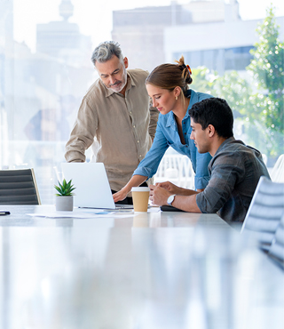 group of coworkers looking at computer