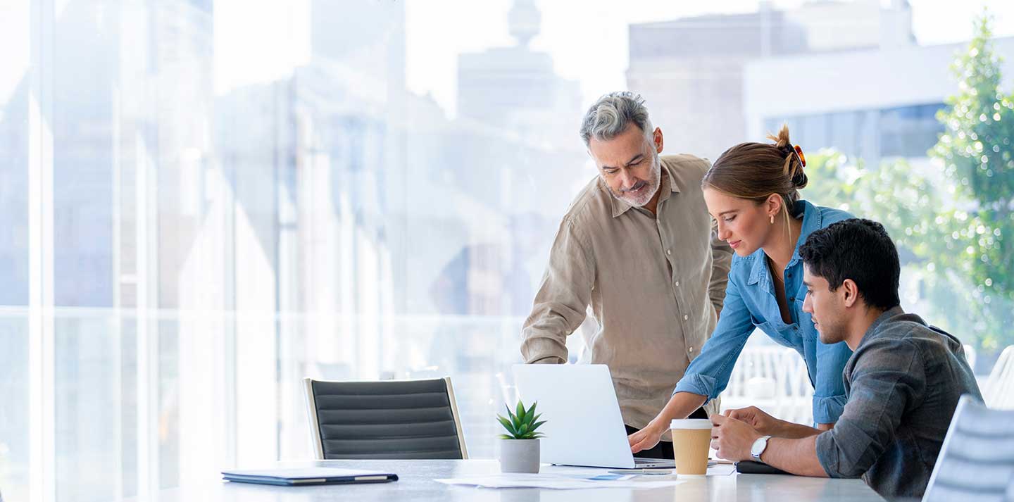 group of coworkers looking at computer