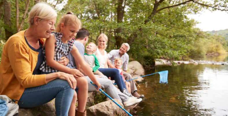 Multigenerational family fishing in the U.K. lake district, which we mention in our U.K. travel guide.