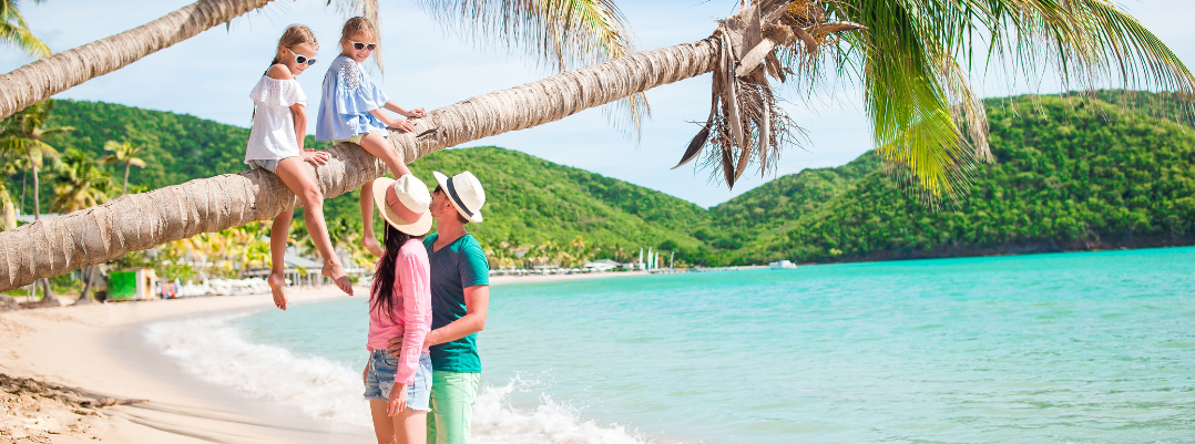 Family on the beach during Caribbean travel.