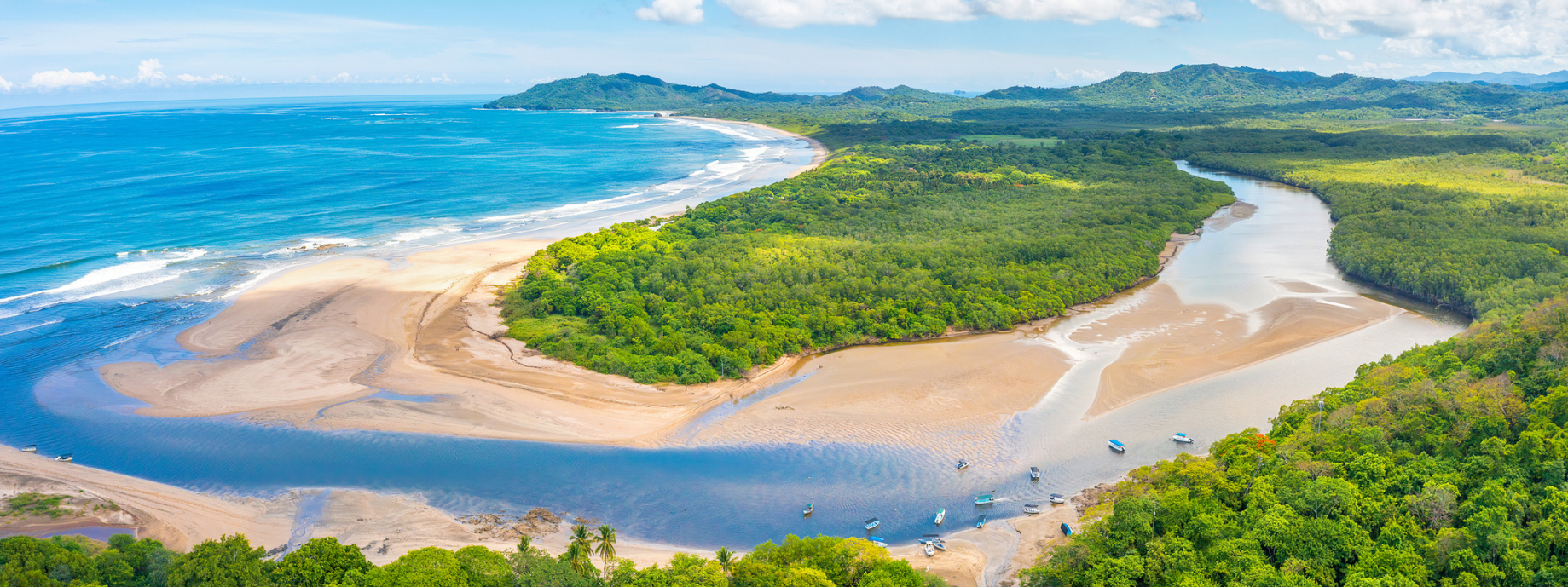 Aerial view of beach, ocean, and foliage for travel insurance for Costa Rica page