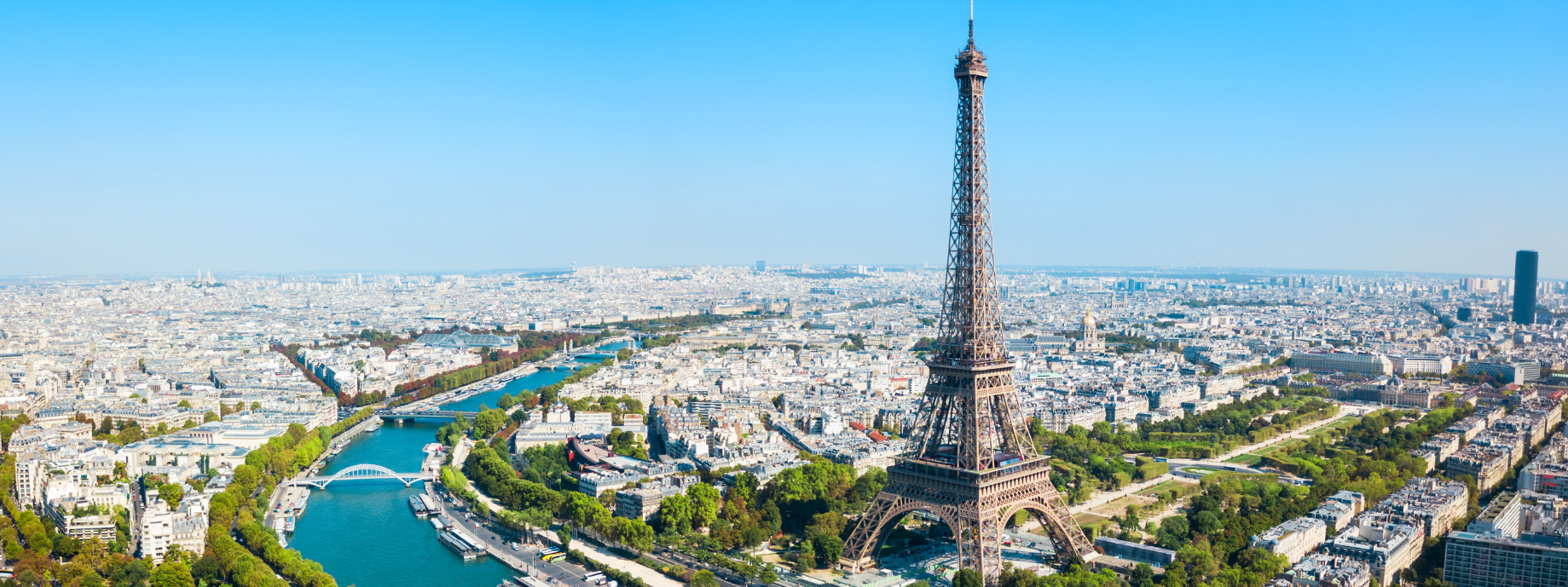 Daytime aerial view of the Eiffel Tower in Paris, where you can travel with travel insurance for France