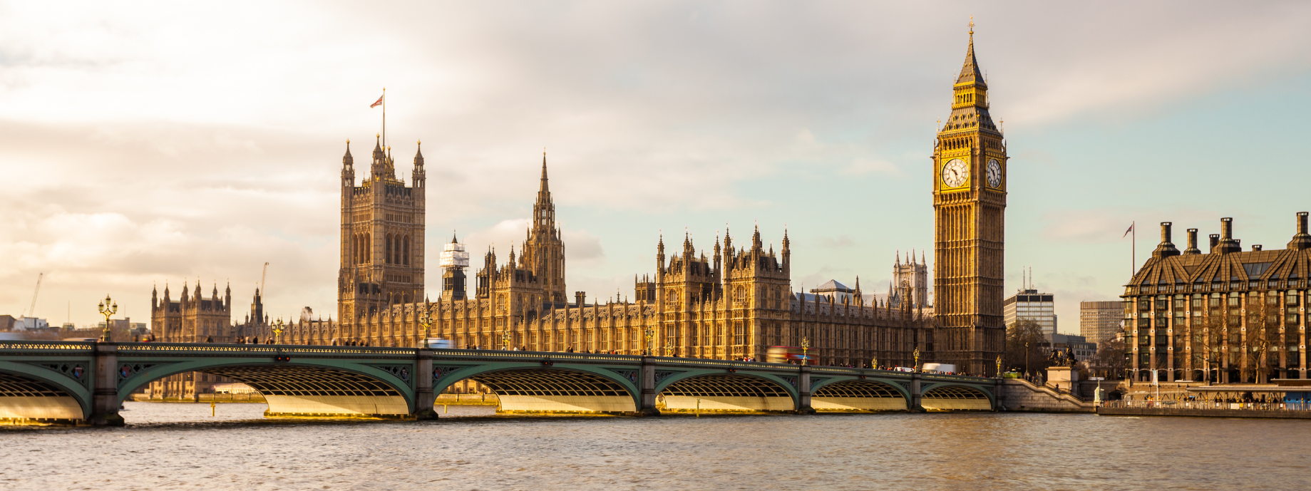 View of Westminster Bridge, River Thames, and Big Ben in London, where you can travel with travel insurance for the U.K.