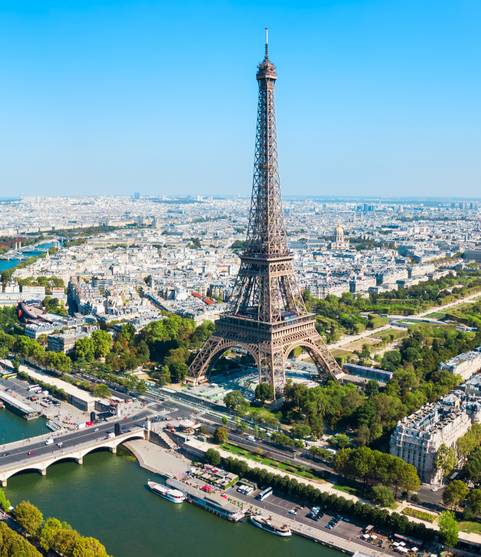 Daytime aerial view of the Eiffel Tower in Paris, where you can travel with travel insurance for France