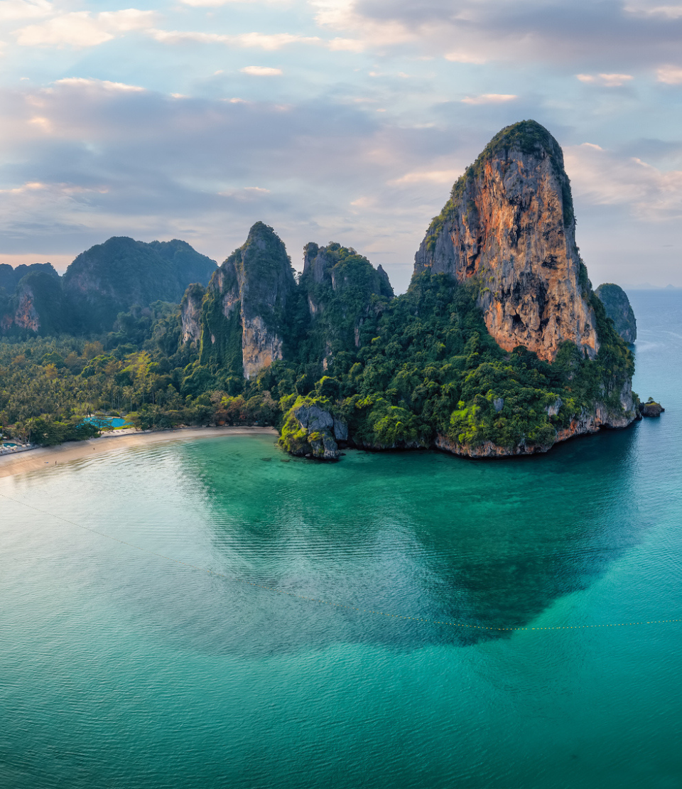 View of mountains and ocean at Railay Beach in Krabi, where you can explore with travel insurance for Thailand