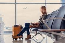 Woman waiting at airport gate