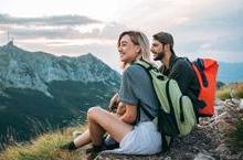 Two travelers on a mountaintop