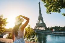 Woman gazing at Eiffel Tower