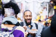 Man smiling and eating