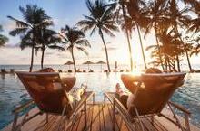 Couple relaxing by a pool at a resort