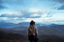 Woman gazing at mountain range