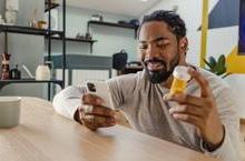 Man ordering prescription on phone