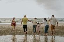 A large family gathered on the beach