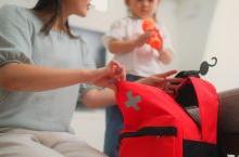 Woman and girl packing an emergency bag.