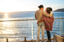 This couple with child on ship deck could use tips from our cruise safety guide