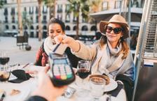 Woman handing credit card to server