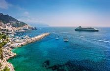 Cruise ship pulling up to a beautiful island