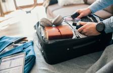 Man packing suitcase for business trip