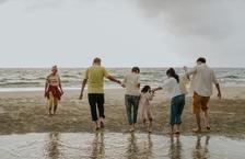 A large family gathered on the beach