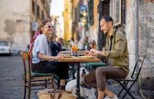 A couple eating at an outdoor cafe