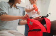 Woman and girl packing an emergency bag.