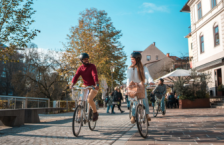 Couple touring as responsible travelers on bikes to reduce carbon emissions.